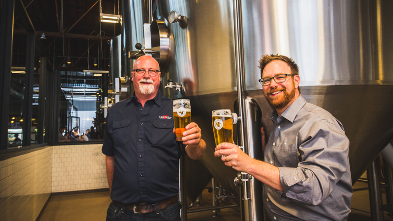 Victory Brewing’s Ron Barchet (left) and Bill Covaleski, with Prima Pils in hand.